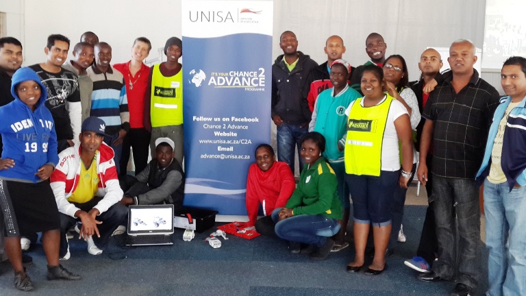 Facilitator Patricia Gouws from School of Computing and I-SET colleagues in the Phoenix Robotics class photo